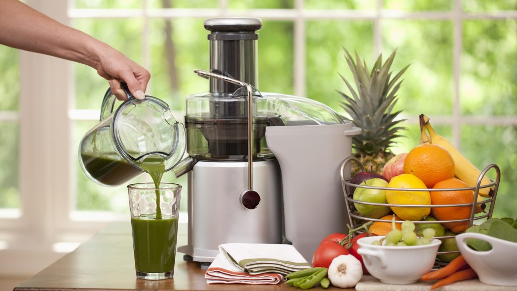 Pouring a Glass of Fresh Organic Green Juice